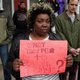 A demonstrator from Baltimore’s Sandtown neighborhood holds a sign seeking answers in the death of Freddie Gray, across the street from the Baltimore Police Western District station, during a protest against police brutality and Gray’s death.
Chip Somodevilla/Getty Images